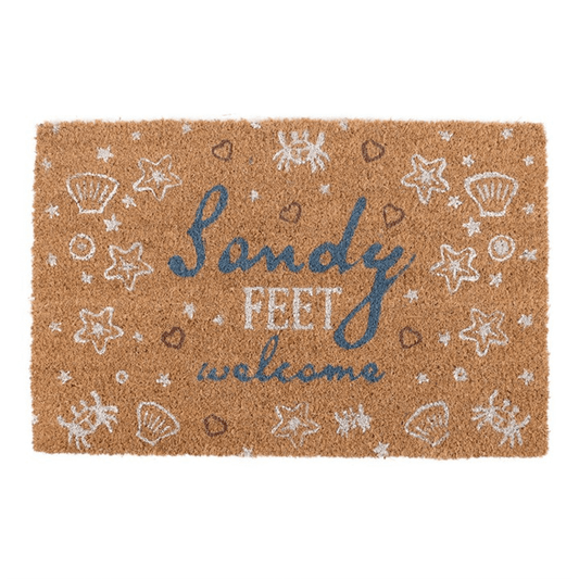 Doormat with 'Sandy Feet Welcome' text and beach-themed graphics on a white background