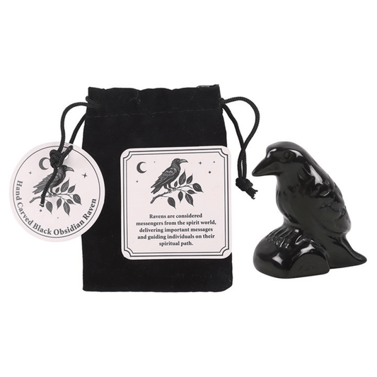 Black obsidian raven figurine with packaging and label on a white background