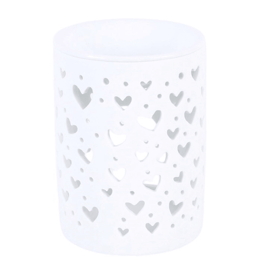 White heart cut out oil burner for home fragrance and ambient lighting.