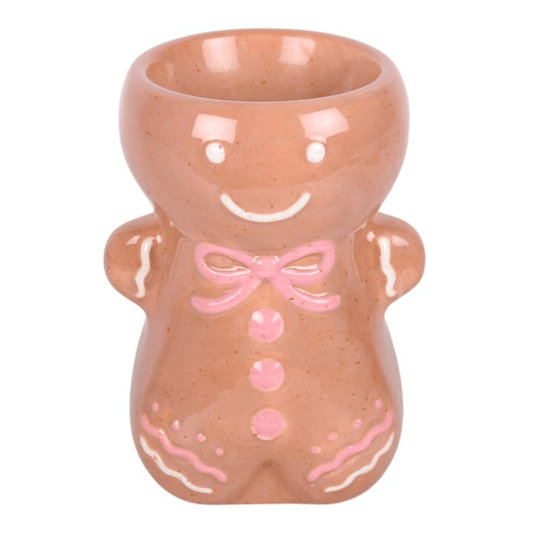 Pink Gingerbread Man Oil Burner with a smiling face and decorative details for festive home fragrance.