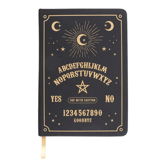 Black notebook with gold Ouija board design on a white background