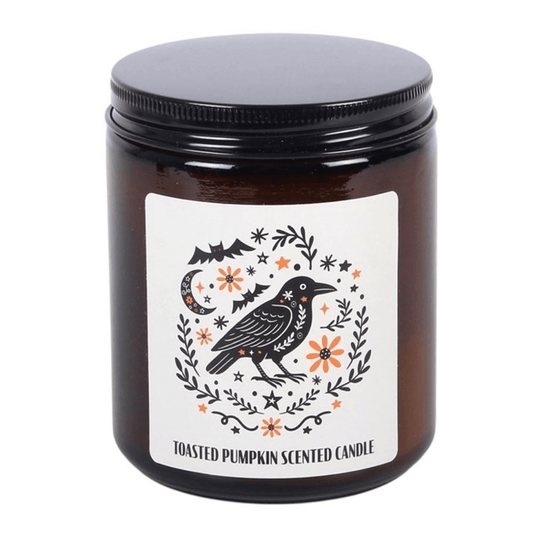 Toasted pumpkin scented candle in brown apothecary jar with raven design, perfect for autumn evenings.
