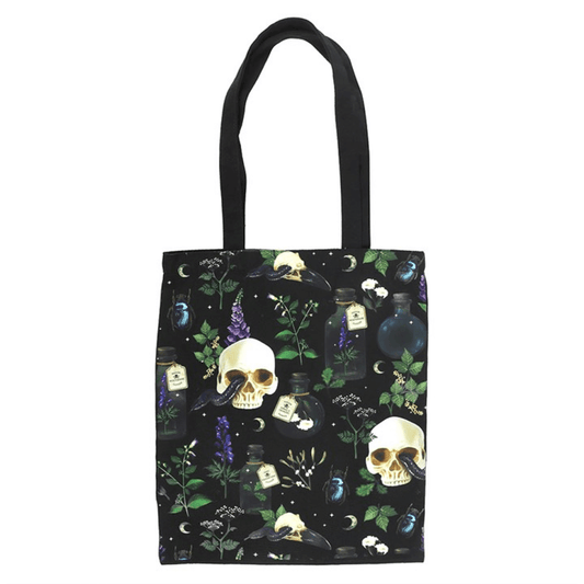 Tote bag with skull and potion design on a black background
