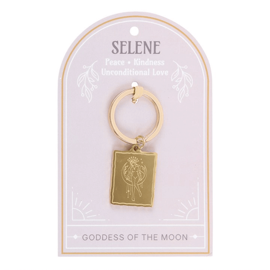 Gold keychain with a tag featuring the brand 'Selene' on a white background