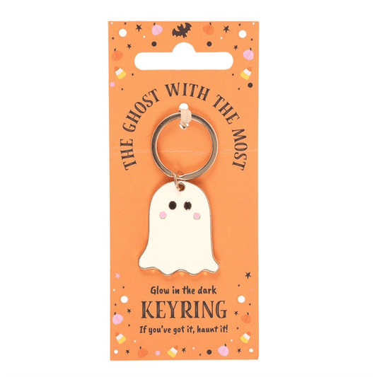 Glow-in-the-dark ghost keyring on an orange packaging with Halloween-themed text and graphics.
