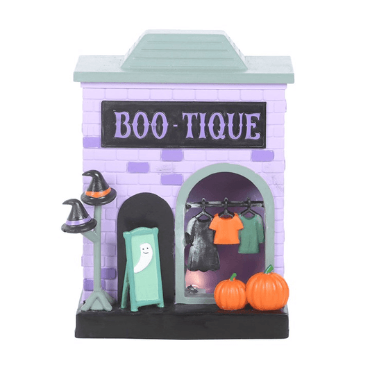 Boo-tique LED Light Up Decoration featuring warm lights, pumpkins, and Halloween costumes for festive displays.