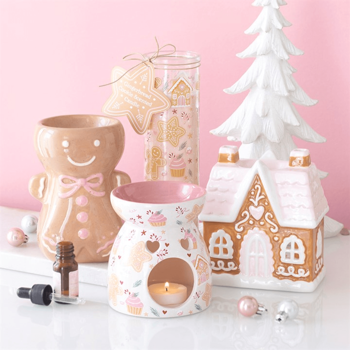 Sugarplum Gingerbread House Oil Burner and Wax Warmer displayed with festive decor.