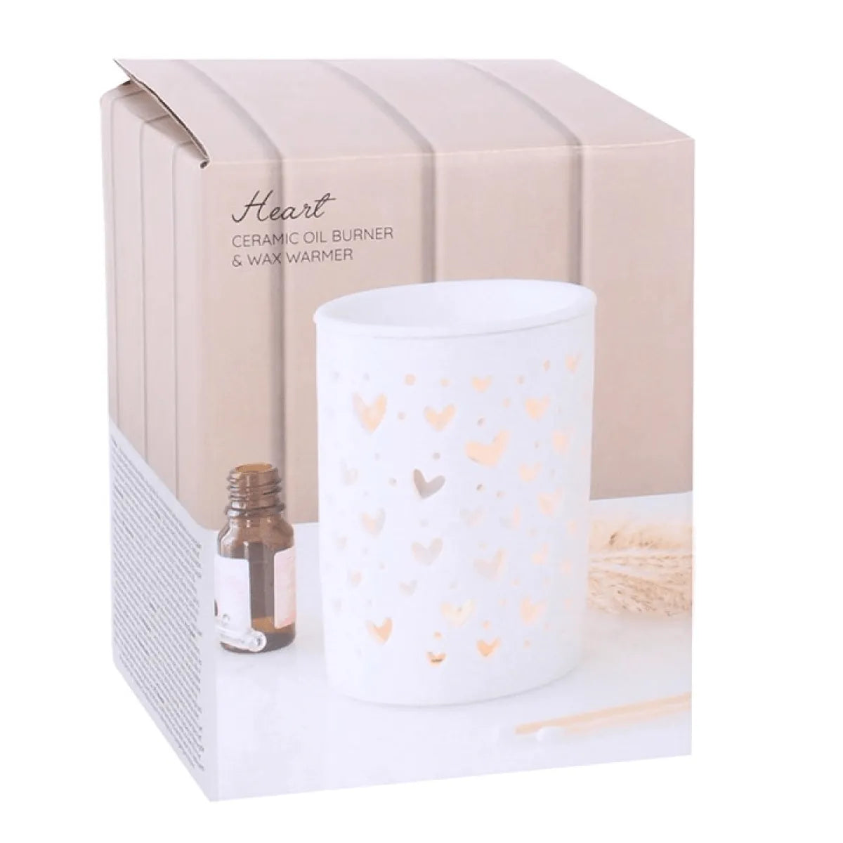 White heart cut out oil burner and wax warmer in decorative box, ideal for home fragrance.
