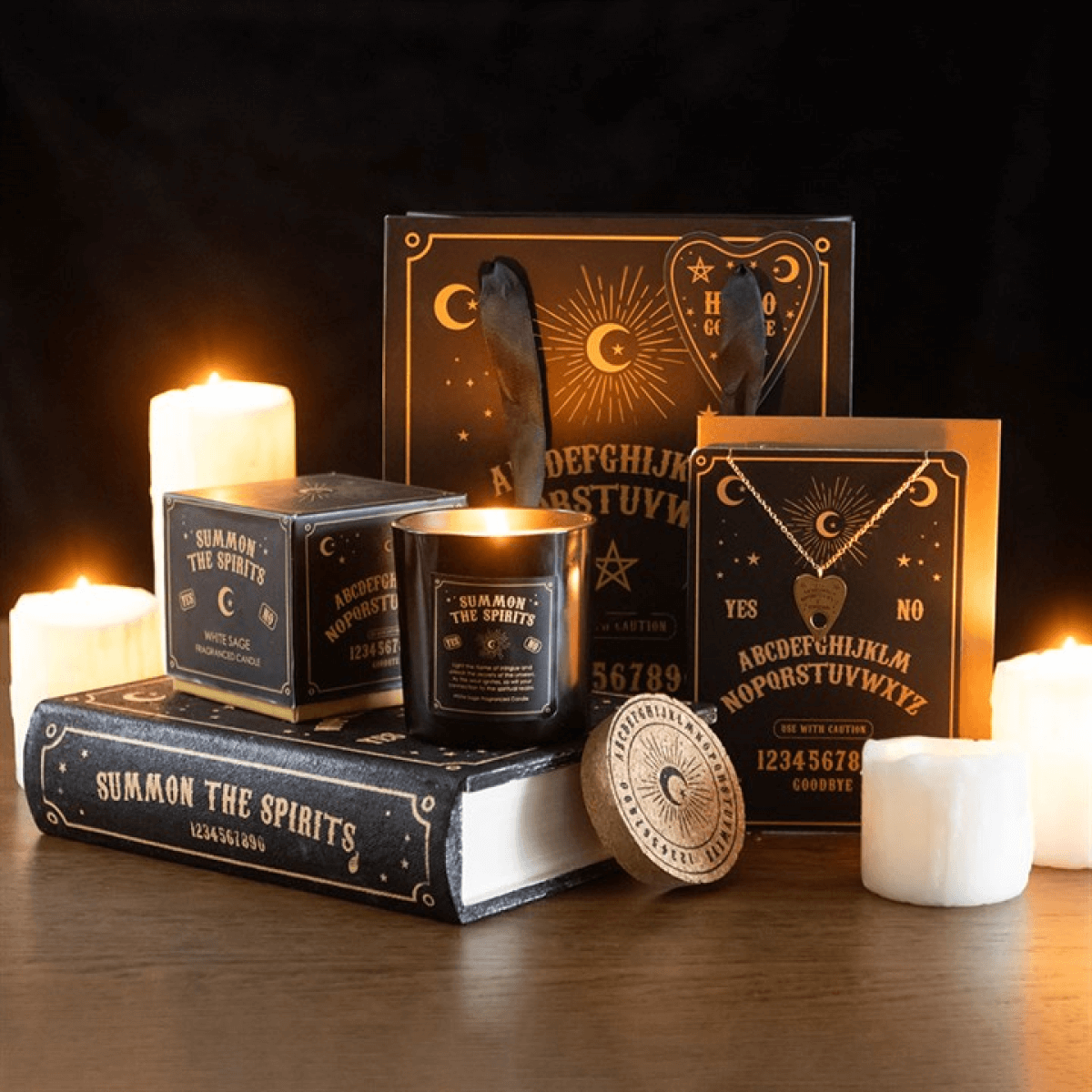 Decorative set with candles, books, and cards on a dark background