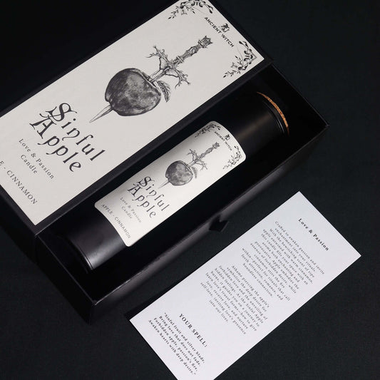 Ancient Witch Ritual Candles - Sinful Apple in packaging with fragrance description of apple and cinnamon.