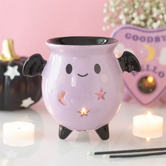 Pastel Bat Brew Cauldron Oil Burner with cute bat wings and cut-outs for moon and star details.