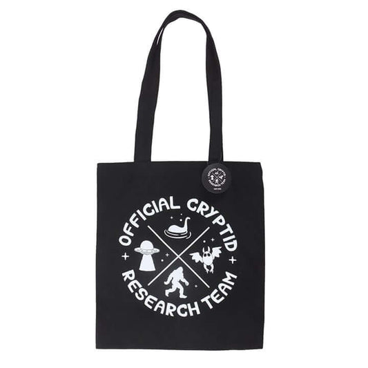 Black tote bag with 'Official Cryptid Research Team' design on a white background