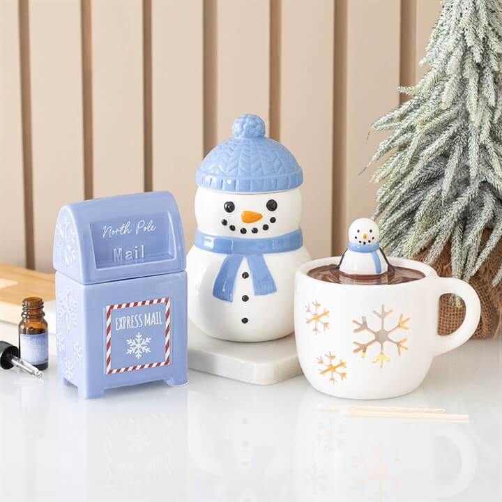 Snowman Hot Chocolate Oil Burner and Wax Warmer with cheerful snowman design and festive mug.
