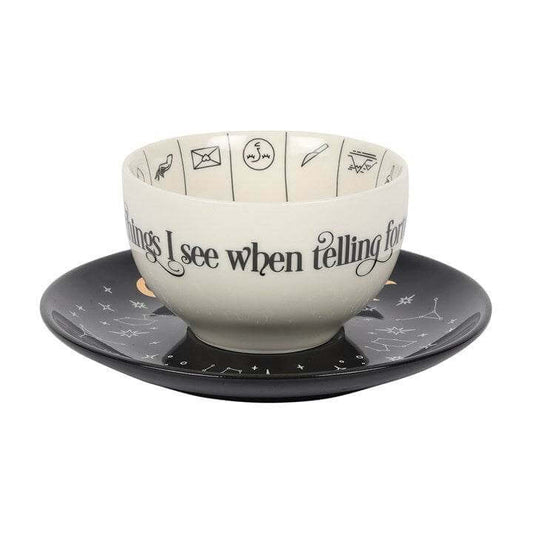 Fortune Telling Ceramic Teacup with Saucer showing symbols for tea leaf reading and mystic designs.