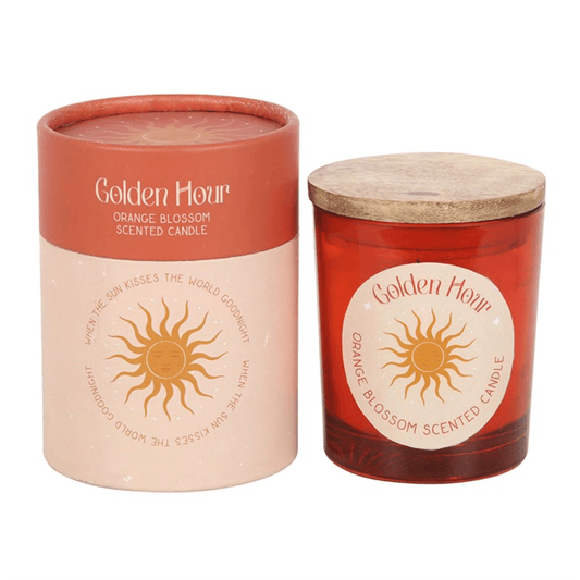 Golden Hour Orange Blossom Candles in decorative containers with floral design, perfect for creating a warm atmosphere.