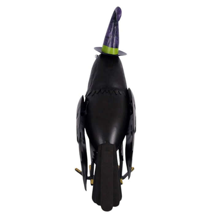 Metal raven ornament with witch hat, perfect for Halloween decor and seasonal displays.