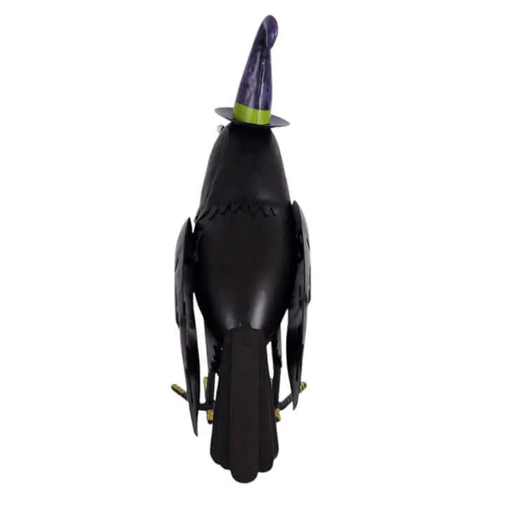 Metal raven ornament with witch hat, perfect for Halloween decor and seasonal displays.