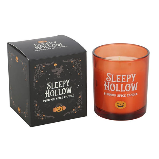Sleepy Hollow Pumpkin Spice Candle in an orange glass jar with autumn-themed packaging.