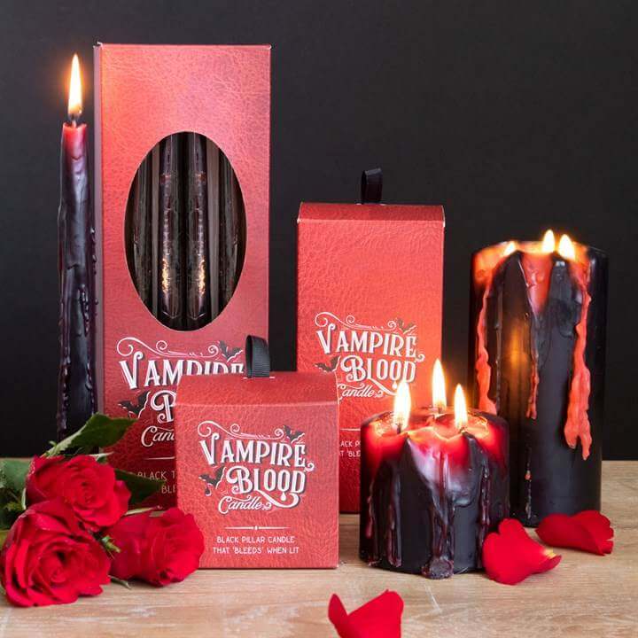 Large Vampire Blood Pillar Candle collection with bleeding wax effect, surrounded by roses and candlelight.