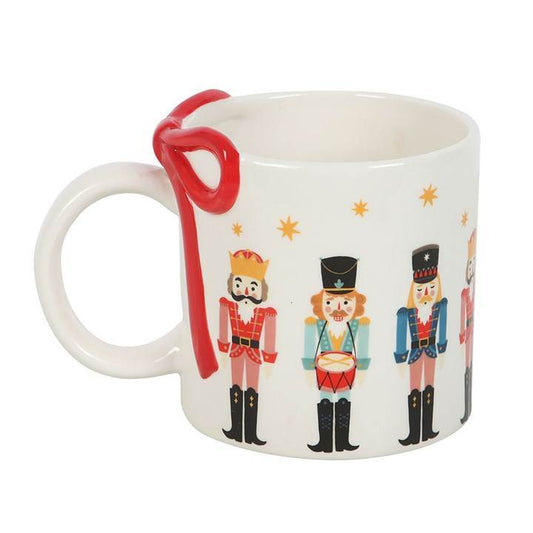 Nutcracker Print Mug with decorative bow, perfect for festive hot chocolate mug, ideal for cozy winter drinks.