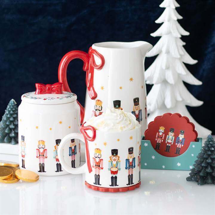 Festive nutcracker print hot chocolate mug with matching creamer and sugar bowl, perfect for Christmas drinks.