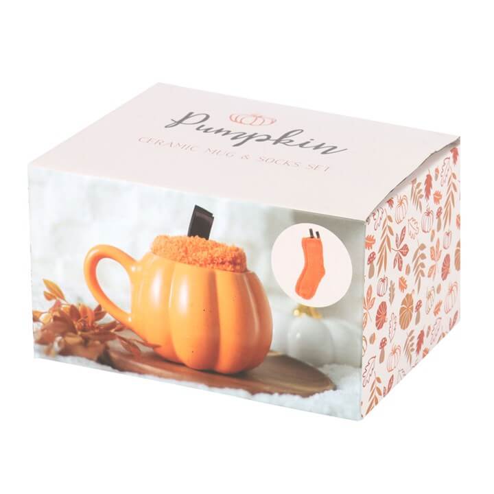 Pumpkin Shaped Mug and Socks Set packaged in a decorative box featuring autumn leaves and a pumpkin design.