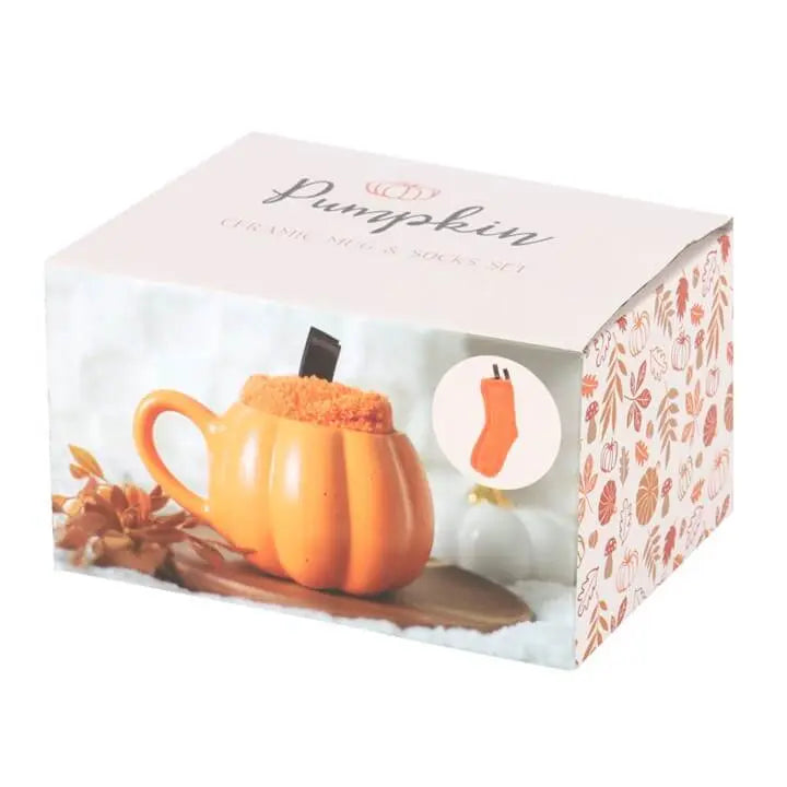 Pumpkin Shaped Mug and Socks Set packaged in a decorative box featuring autumn leaves and a pumpkin design.