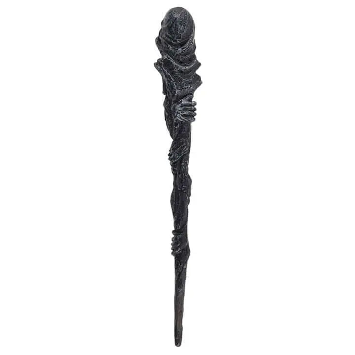 Decorative staff with intricate design on a white background