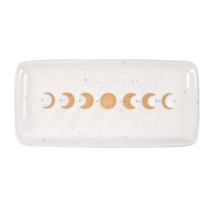 Rectangular ceramic dish with gold moon phases on a white background