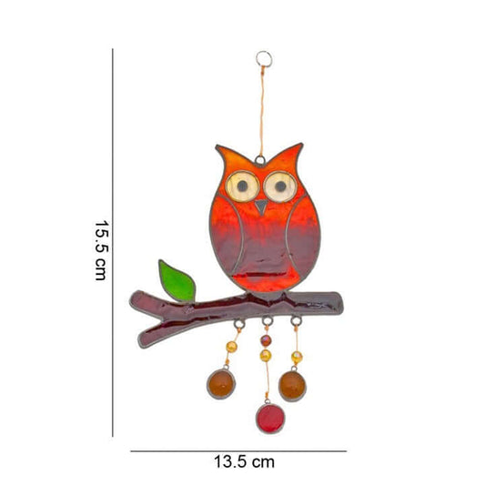 Decorative owl ornament with measurements on a white background