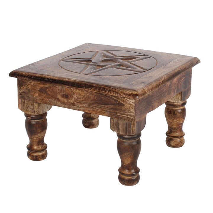 Wooden stool with a pentagram design on a white background