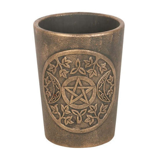 Ceramic cup with pentagram design on a white background
