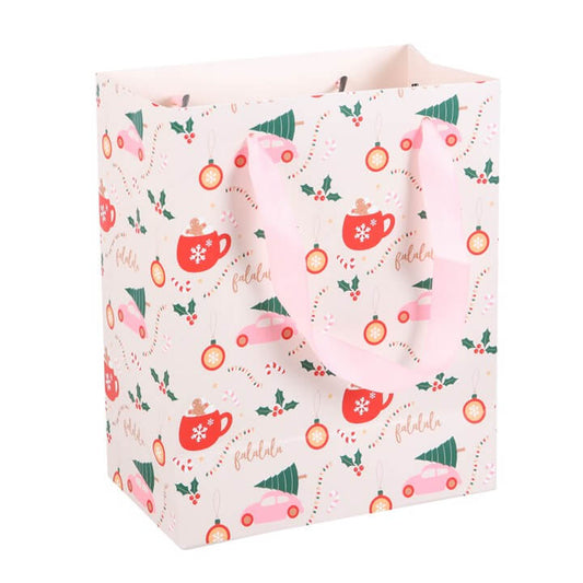 Gift bag with festive design featuring mugs, trees, and ornaments on a white background