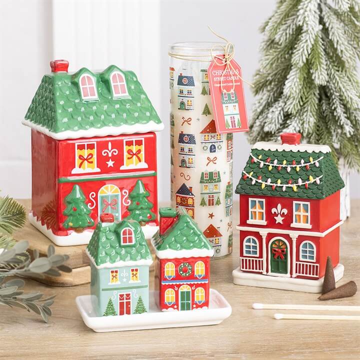 Red Christmas house incense cone burner with decorative snowy details for festive home fragrance.