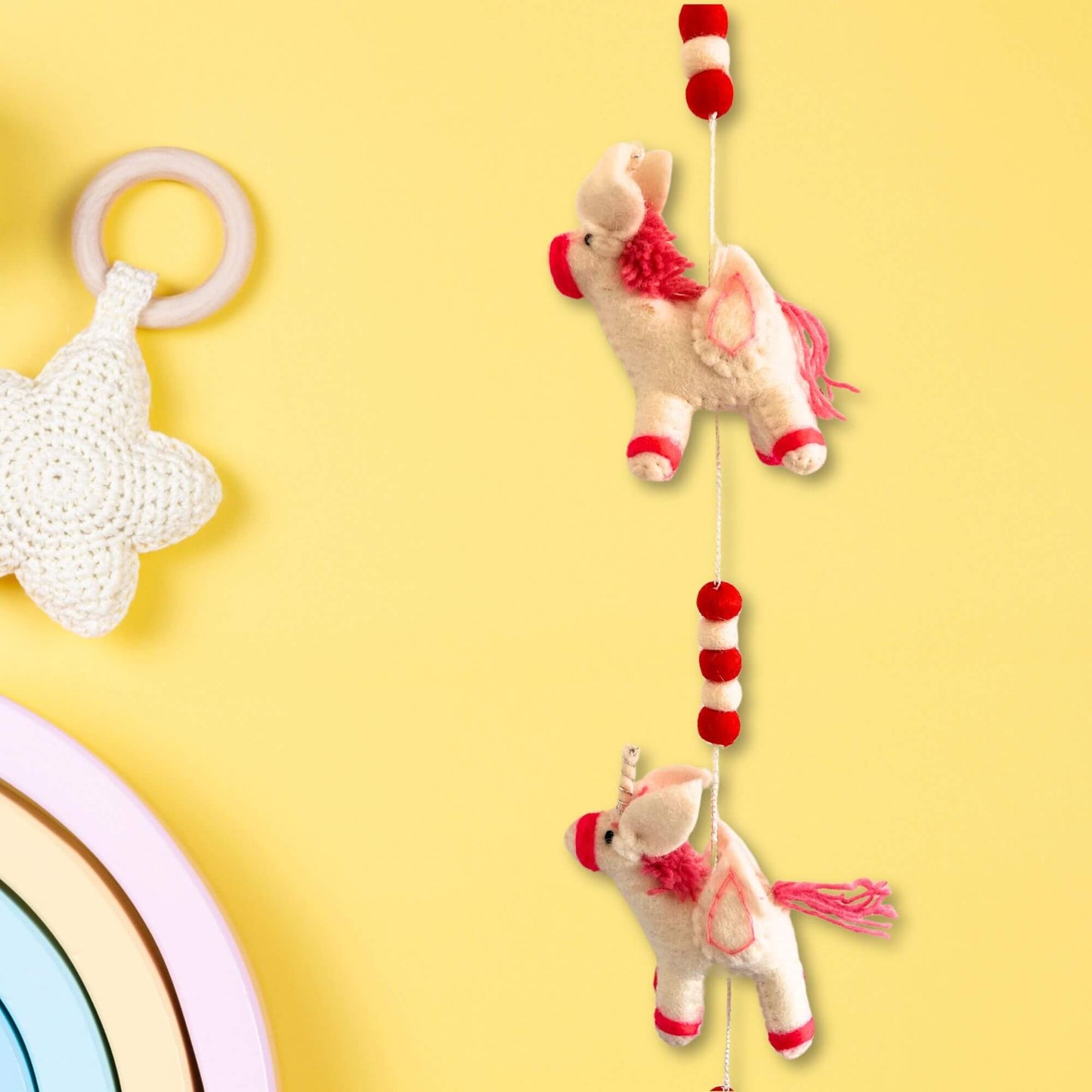 Felt Wall Hanging Unicorns hanging decor featuring charming unicorn designs in vibrant colors.