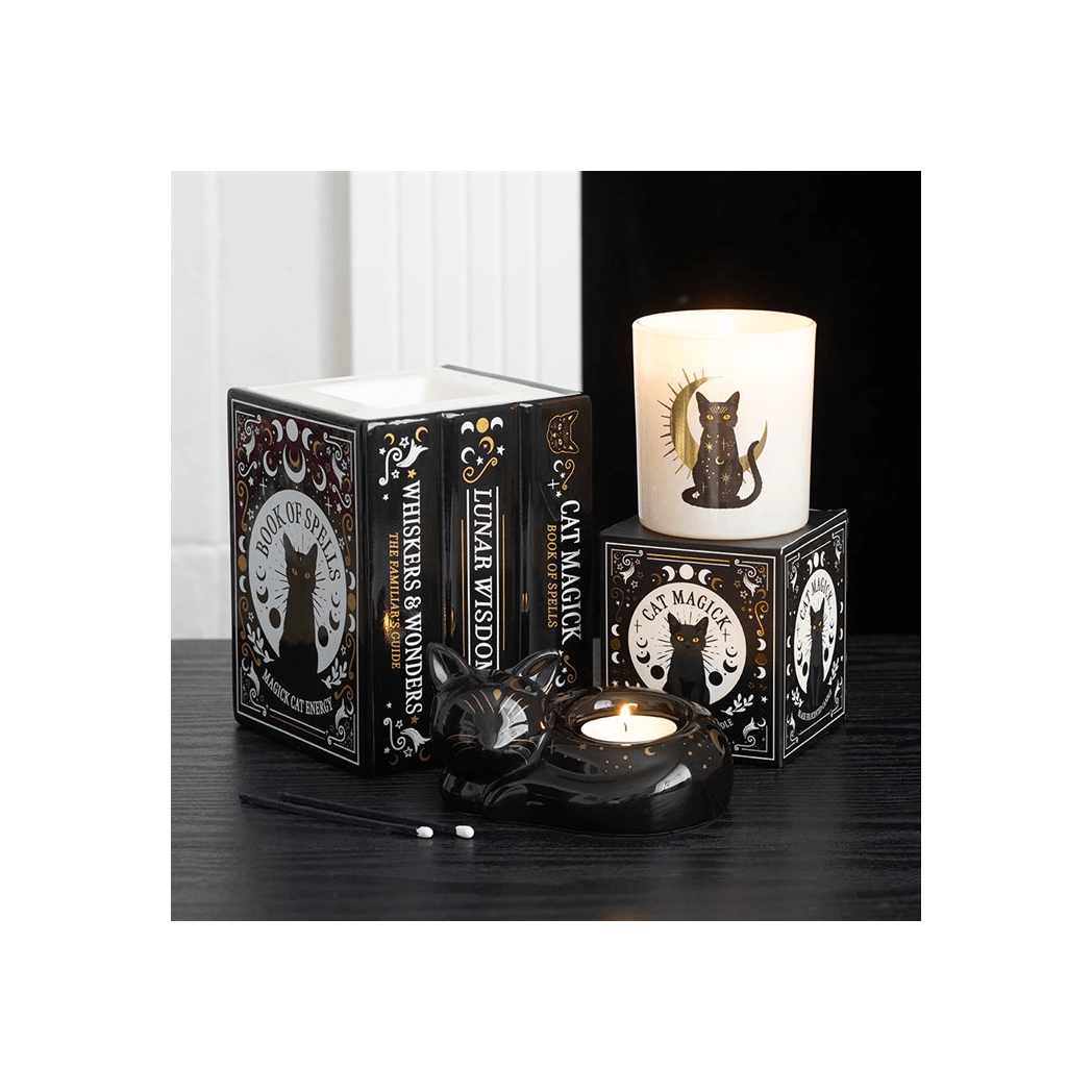 Black Fig Candle displayed with stylish packaging, featuring black cat design and ornate details in a gothic setting.