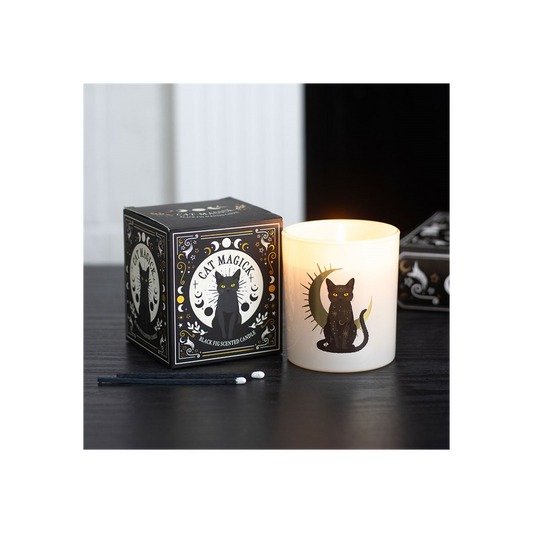 Black Fig Candle in a stylish gothic box, featuring a black cat design, casting a warm glow on a dark surface.