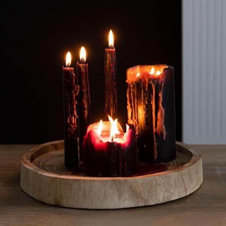15cm Vampire Tears Pillar Candle in gothic red drip effect on wooden tray, creating a dramatic, atmospheric decor.