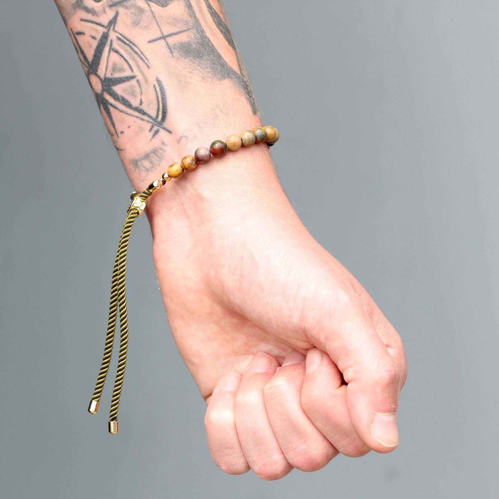 18K Gold Plated Gemstone Moss String Bracelet on wrist featuring Picasso Jasper and adjustable toggle.