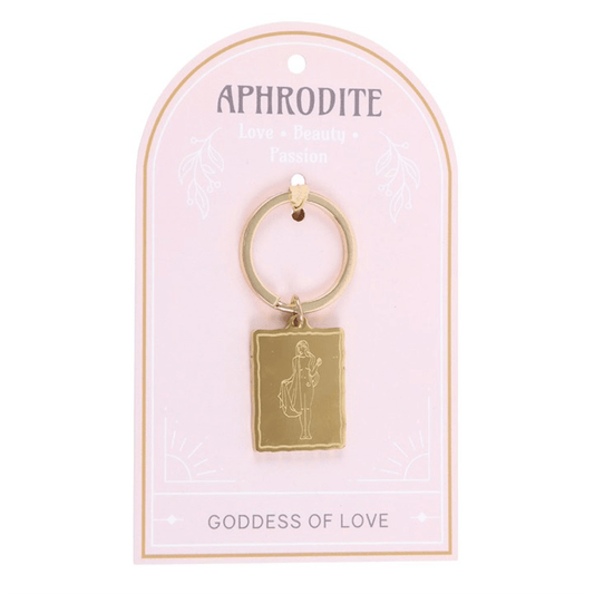 Gold keychain with a rectangular pendant on a pink card featuring 'Aphrodite' and 'Goddess of Love'.