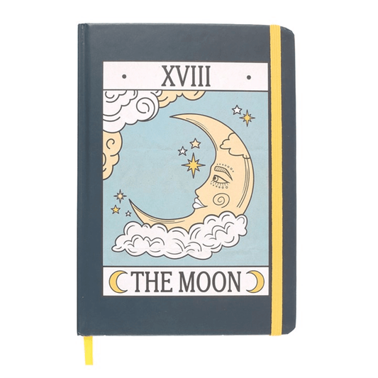 Notebook with a celestial design featuring a moon and stars on a white background