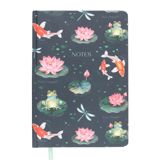 Notebook with pond-themed design featuring frogs, lotus flowers, and koi fish on a dark blue background.