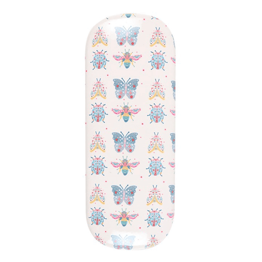 Floral-patterned ironing board cover with butterflies on a white background