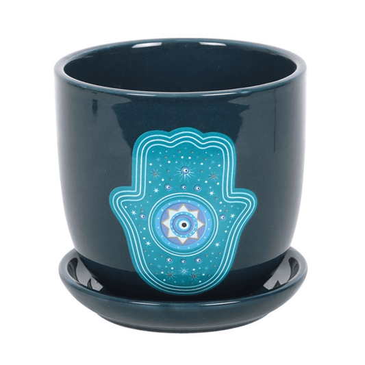 Dark blue ceramic pot with a Hamsa hand design on a white background