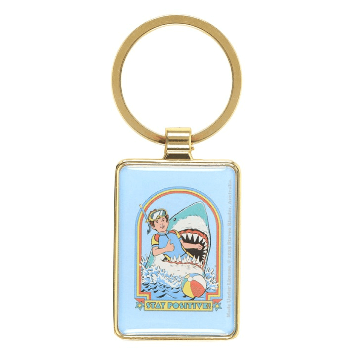 Keychain with a cartoon design of a shark and person on a beach, with 'Stay Positive' text, on a light blue background.