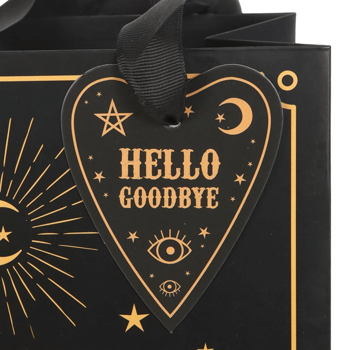 Black gift bag with gold 'Hello Goodbye' heart-shaped tag and celestial designs.