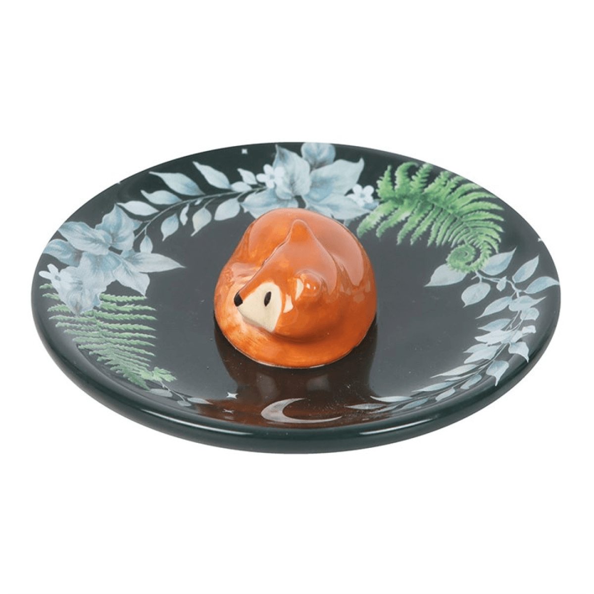 Decorative plate with a fox figurine and leaf patterns on a white background