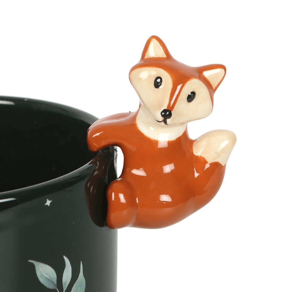 Ceramic fox-shaped mug hugger on a black mug with a white background