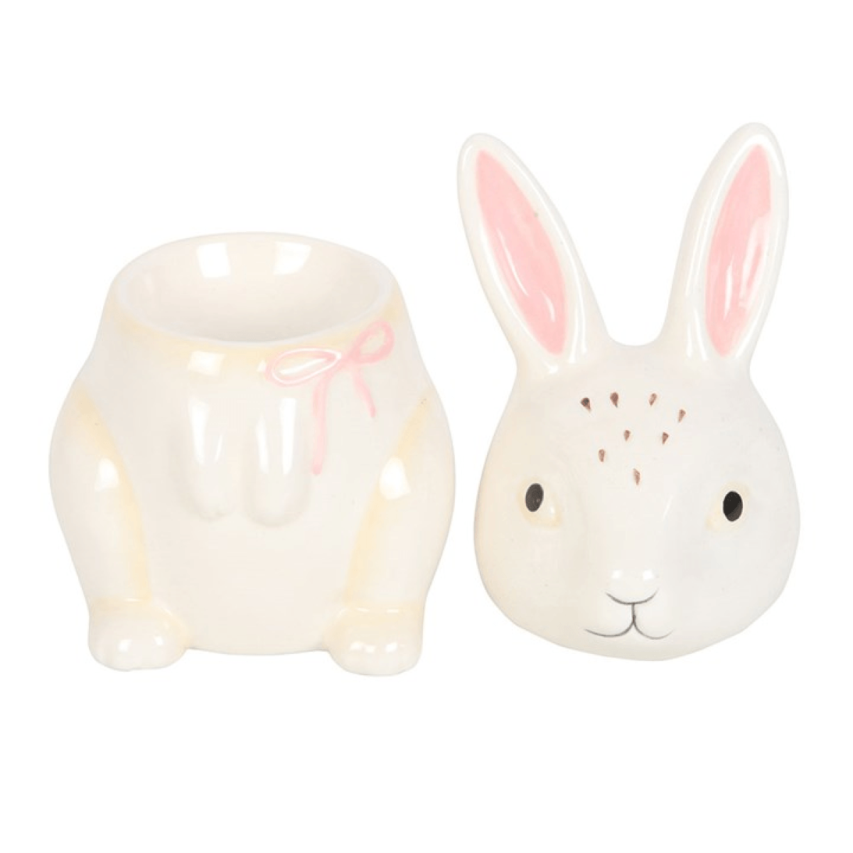Two ceramic rabbit-shaped items on a white background