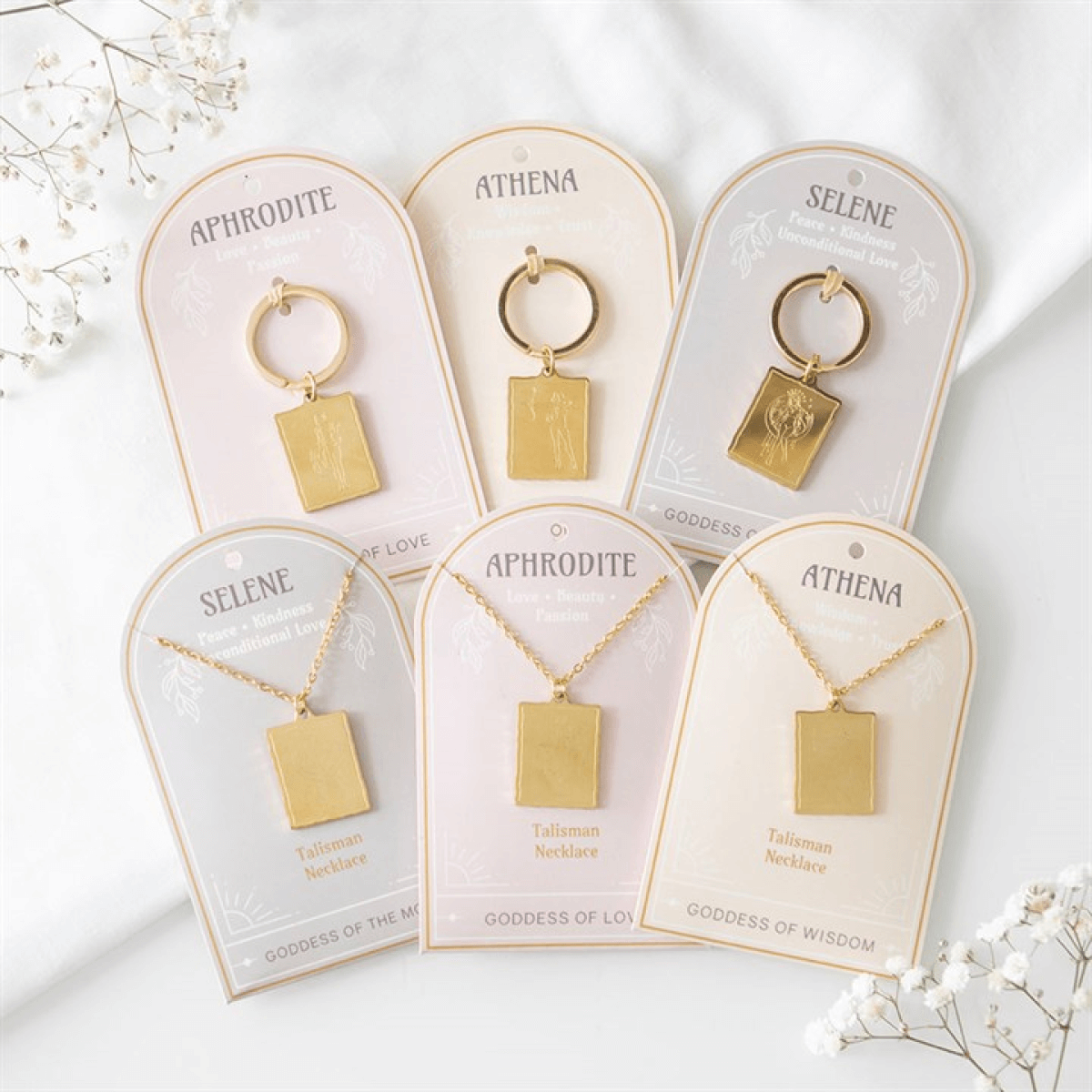 Gold necklaces and earrings on name cards with 'Aphrodite', 'Athena', and 'Selene' names on a white background.